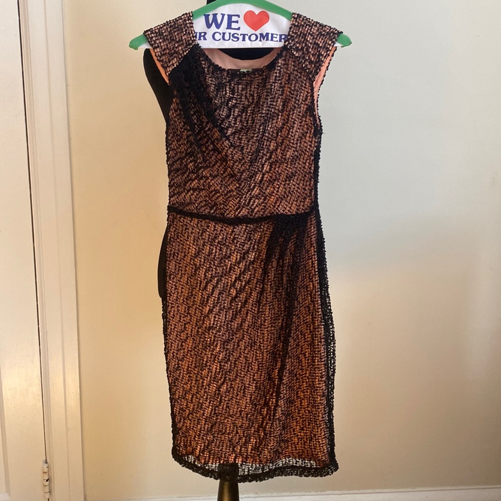 Black and salmon colored dress. Black appliqué is over the salmon color! Awesome